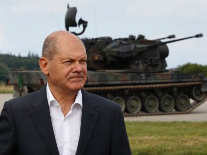 OLDENBURG IN HOLSTEIN, GERMANY - AUGUST 25: German Chancellor Olaf Scholz poses in front of an anti-aircraft gun tank Gepard during his visit a training facility of the arms-maker Krauss-Maffei Wegmann at the Putlos military training area on August 25, 2022 in Oldenburg in Holstein, Germany. Germany has promised Ukraine …