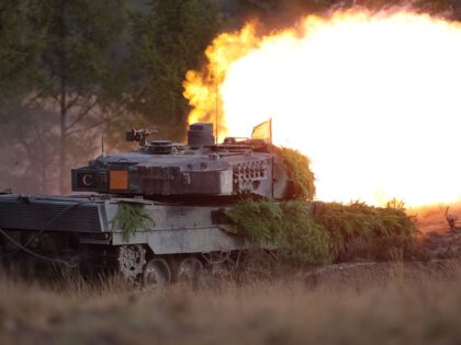 TOPSHOT - A Puma infantry fighting vehicle of the German armed forces Bundeswehr shoots during a visit by the German Chancellor of German Bundeswehr's troops during a training exercise at the military ground in Ostenholz, northern Germany, on October 17, 2022. (Photo by Ronny HARTMANN / AFP) (Photo by RONNY …