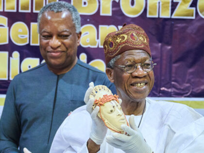 20 December 2022, Nigeria, Abuja: Alhaji Lai Mohammed (r), Minister of Information and Cul