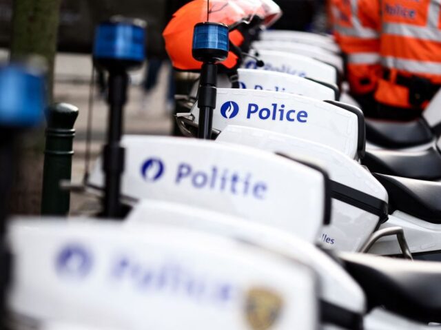 This photograph shows a Belgian police logo on police bikes during a protest near the head