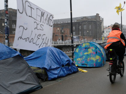 BRUSSELS, BELGIUM - FEBRUARY 23: A sign that reads: nobody is illegal, in Flemish. Around 200 people camped in tents at the Molenbeek canal, in front of the Petit Château in Brussels, the arrival centre managed by the Federal Government reception agency Fedasil, amid a backlog in processing asylum applicants. …