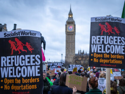 Hundreds pf people gather in Westminster with loud voices and placards to stand against plans for mass detention of asylum seekers and the rejection of refugees in a bill proposed by the government as it is discussed in the Houses of Parliament on the 13th of March 2023 in London, …