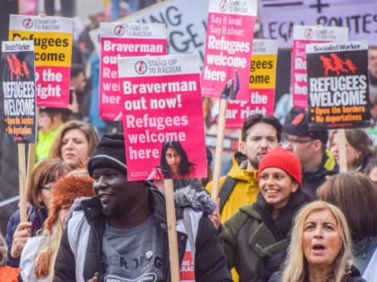 LONDON, UNITED KINGDOM - 2023/03/18: A protester holds a placard demanding the removal of Home Secretary Suella Braverman, during the demonstration in Piccadilly Circus. Thousands of people marched through Central London in support of refugees and in protest against racism and the UK Government's Illegal Migration Bill. (Photo by Vuk …