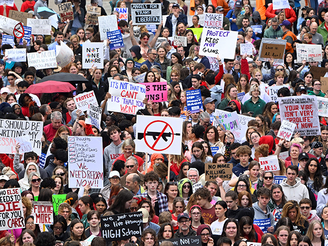 Anti-gun demonstrators protest at the Tennessee Capitol for stricter gun laws in Nashville, Tennessee, on April 3, 2023. - Students were encouraged by an anti-gun violence group to walk out of classrooms at 10:13 AM, the same time police say a transgender person entered The Covenant School beginning an attack …