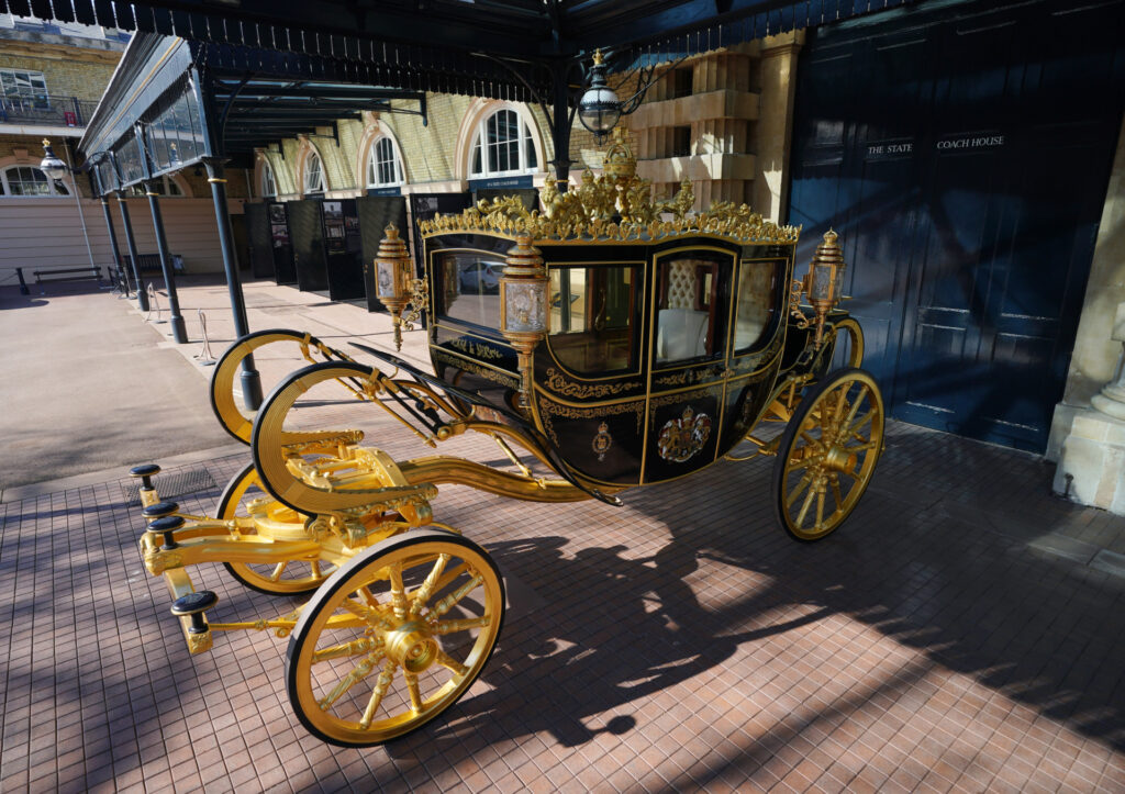 The Diamond Jubilee State Coach on display at the Royal Mews in Buckingham Palace, London, ahead of King Charles III's Coronation on May 6. The King and Queen Consort will travel to the coronation in the modern Diamond Jubilee State Coach and return in the historic Gold State Coach. Picture date: Tuesday April 4, 2023. (Photo by Yui Mok/PA Images via Getty Images)