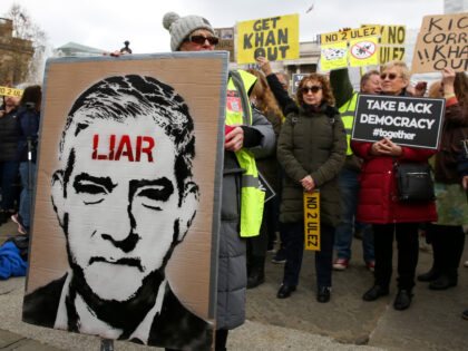 LONDON, UNITED KINGDOM - 2023/04/15: A protester holds a painting of Sadiq Khan during the