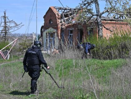 Ukrainian sappers conduct a demining operation in Grakove village (alternatively spelled "Hrakove"), Kharkiv region on April 18, 2023. - The village, which was occupied by Russian troops on February 25, 2022 and freed on September 2022, is one of the most mined settlement in the region. (Photo by SERGEY BOBOK …