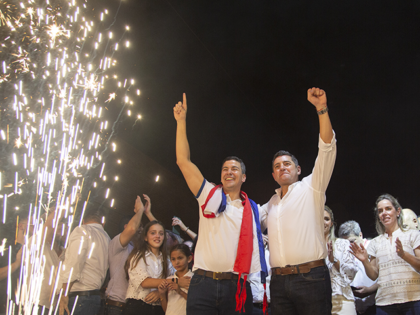 Santiago Pena, Paraguay's president-elect, center, celebrates his victory during an election night rally in Asuncion, Paraguay, on Sunday, April 30, 2023. Pena, a former finance minister, scored a major victory in Paraguay's presidential election Sunday, as voters gave the ruling Colorado Party a third straight mandate to run the South …