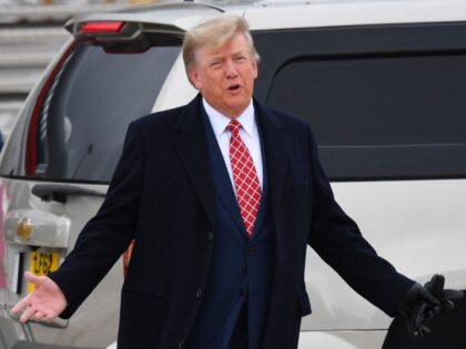 TOPSHOT - Former US President Donald Trump speaks to members of the media on the tarmac after disembarking "Trump Force One" at Aberdeen airport on the north-east coast of Scotland on May 1, 2023, at the start of his first visit to the country since losing the Presidency. (Photo by …