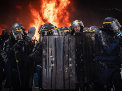 PARIS, FRANCE - 2023/05/01: Police prevent protesters from moving into Place De La Nation after a fire was started below a block of apartments. Thousands of protesters participate in the May Day Rally in Paris. Protests started when Emmanuel Macron introduced the pension reform, which will increase the retirement age …