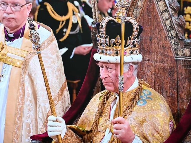 FRANCE-BRITAIN-ROYALS-CORONATION-TV This photograph taken on May 6, 2023 in a newsroom in Paris shows a screen broadcasting the televised coronation ceremony of Britain's newly crowned King Charles III. (Photo by Emmanuel DUNAND / AFP) (Photo by EMMANUEL DUNAND/AFP via Getty Images)