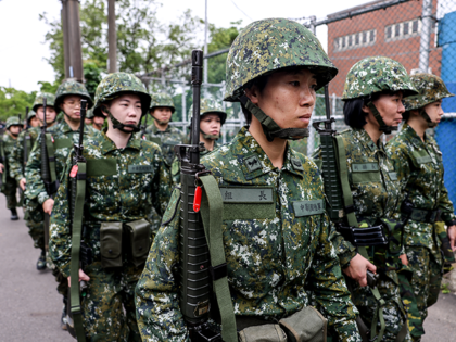 Members of Taiwan's military reserve force march during a training exercise in Taoyuan, Taiwan, on Tuesday, May 9, 2023. Taiwan has found itself under increasing pressure from Beijing, which views the self-governing island as part of its territory. Photographer: I-Hwa Cheng/Bloomberg via Getty Images