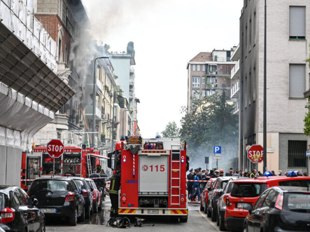 MILAN, ITALY - MAY 11: Firefighters try to extinguish the fire broke out in central Milan,