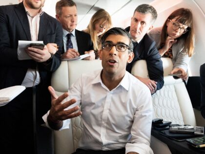 Britain's Prime Minister Rishi Sunak holds a huddle with political journalists on board of a government plane, as he heads to Japan to attend the G7 summit, in Hiroshima, on May 17, 2023. (Photo by Stefan Rousseau / POOL / AFP) (Photo by STEFAN ROUSSEAU/POOL/AFP via Getty Images)