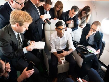 Britain's Prime Minister Rishi Sunak holds a huddle with political journalists on board of a government plane, as he heads to Japan to attend the G7 summit, in Hiroshima, on May 17, 2023. (Photo by Stefan Rousseau / POOL / AFP) (Photo by STEFAN ROUSSEAU/POOL/AFP via Getty Images)