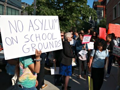BROOKLYN, NY - May 16, 2023 - Students and parents from Public School MS 577 walk march around the school located at N 5th Street and Roebling Streets protesting Migrants being housed at the School gymnasium. The Migrants placed at the Gymnasium were removed around 2:00AM to unknown location in …