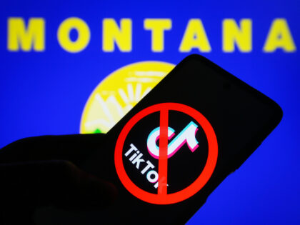 KYIV, UKRAINE - 2023/05/18: In this photo illustration, a crossed-out TikTok logo is seen on a smartphone and flag of the state of Montana on a pc screen. (Photo Illustration by Pavlo Gonchar/SOPA Images/LightRocket via Getty Images)