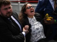 Climate Protesters Crash Shell Shareholders Meeting