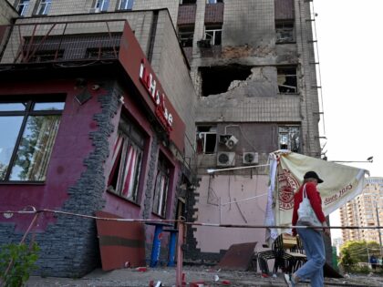 A local resident walks past a partially destroyed residential building after a massive Russian drones strike mainly targetting the Ukrainian capital, in Kyiv, on May 28, 2023. Russia carried out the "most important" drone attack on Kyiv overnight Saturday-Sunday since the start of the invasion, military authorities said. "In total …