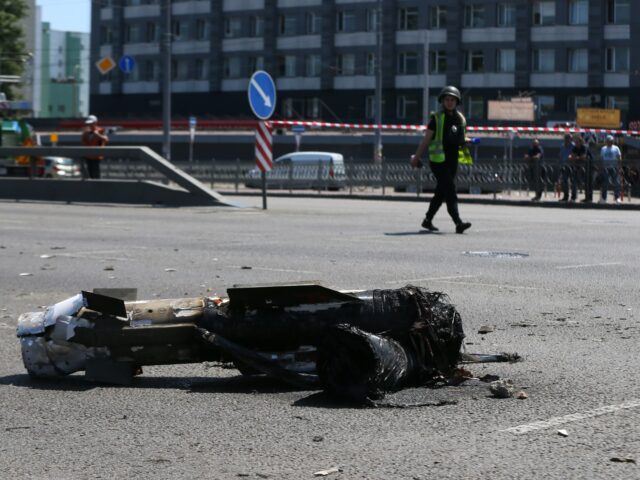 A part of a missile which landed on a street is seen after a Russian missile strike in Kyi