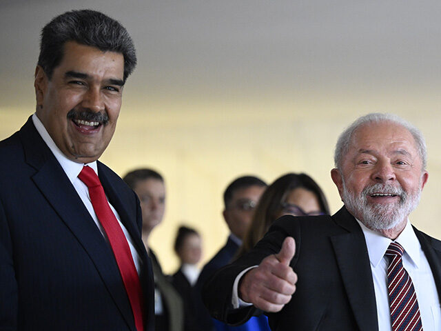 Brazilian President Luiz Inacio Lula da Silva bids farewell to Venezuelan President Nicola