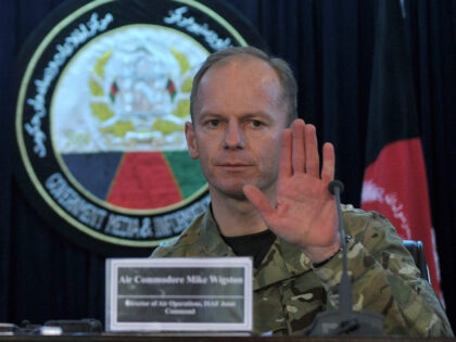 British Air Commodore Mike Wigston (R) talks during a press conference as General Boone International Security Assistance Force (ISAF) communication director looks in Kabul on February 15, 2012. The US-led NATO force in Afghanistan on February 15 conceded that eight young men were killed during a recent air strike but …