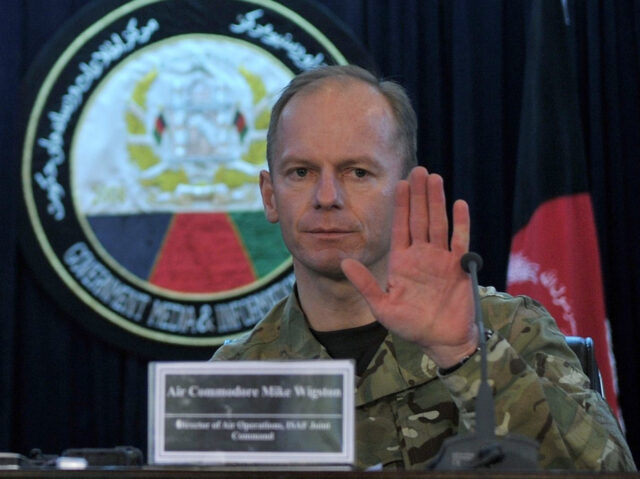 British Air Commodore Mike Wigston (R) talks during a press conference as General Boone In