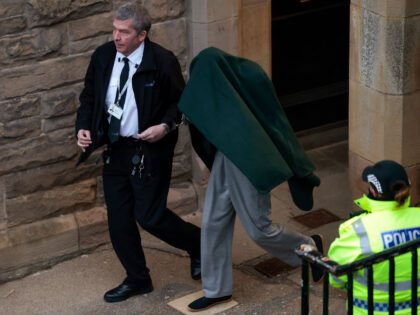 SELKIRK, SCOTLAND - FEBRUARY 09: Andrew Miller is taken from Selkirk Sheriff covered by a blanket on February 09, 2023 in Selkirk, Scotland. Andrew Miller, 53 and locally known as Amy George, is charged with the abduction of an 11-year-old girl in Galashiels in the Scottish Borders. (Photo by Jeff …