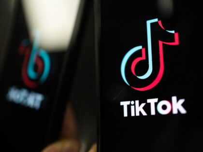 LONDON, ENGLAND - FEBRUARY 28: In this photo illustration, a TikTok logo is displayed on an iPhone on February 28, 2023 in London, England. This week, the US government and European Union's parliament have announced bans on installing the popular social media app on staff devices. (Photo by Dan Kitwood/Getty …