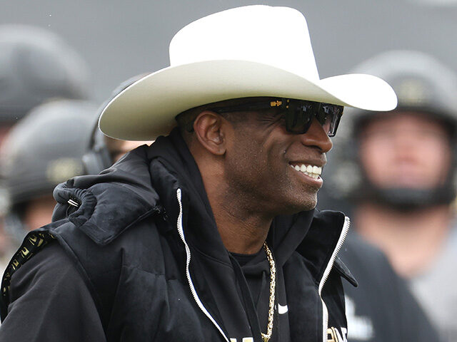 Head coach Deion Sanders of the Colorado Buffaloes watches as his team warms up prior to t