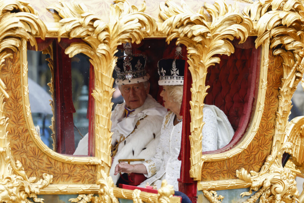LONDON, ENGLAND - MAY 06: King Charles III and Queen Camilla travelling in the Gold State Coach built in 1760 and used at every Coronation since that of William IV in 1831sets off from Westminster Abbey on route to Buckingham Palace during the Coronation of King Charles III and Queen Camilla on May 06, 2023 in London, England. The Coronation of Charles III and his wife, Camilla, as King and Queen of the United Kingdom of Great Britain and Northern Ireland, and the other Commonwealth realms takes place at Westminster Abbey today. Charles acceded to the throne on 8 September 2022, upon the death of his mother, Elizabeth II. (Photo by Jeff J Mitchell/Getty Images)