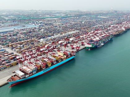 Aerial view of shipping containers sitting stacked at Qingdao Qianwan Container Terminal on May 9, 2023 in Qingdao, Shandong Province of China. (Photo by Xue Jingwen/VCG via Getty Images)