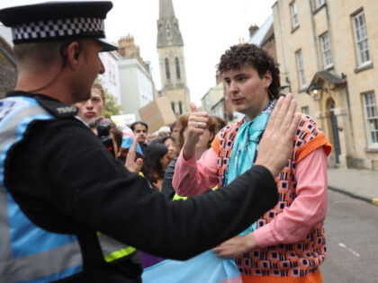 OXFORD, ENGLAND - MAY 30: A police officer talks to Amiad Haran Diman, president of the university's LGBTQ+ Society outside The Oxford Union on May 30, 2023 in Oxford, England. Dr.Kathleen Stock is a philosopher, writer and former professor. She has spoken against proposed changes to the Gender Recognition Act …