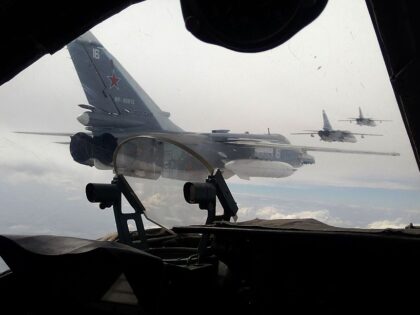Russian Air Force Su-24 bombers fly during a military exercise in southern Russia on February 11, 2015. Marathon talks in Belarus ended on February 12 with a ceasefire announcement in the war between Ukraine and pro-Moscow rebels, but Germany's Chancellor Angela Merkel warned that "big hurdles" remained. AFP PHOTO / …