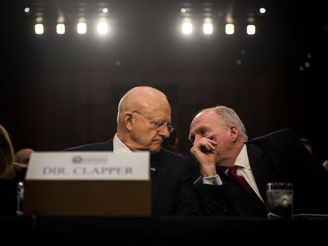 WASHINGTON, DC - FEBRUARY 9: Director of National Intelligence James Clapper speaks to CIA Director John Brennan before the start of the Senate (Select) Intelligence Committee hearing at the Hart Senate Building on February 9, 2016 in Washington, D.C. The committee met to hear testimony about worldwide threats to America and its allies. (Photo by Gabriella Demczuk/Getty Images)
