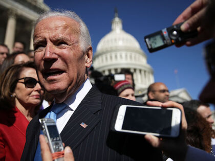 Former U.S. Vice President Joseph Biden (R) speaks to members of the media as House Minority Leader Rep. Nancy Pelosi (D-CA) (L) looks on after an event on health care at the House East Front of the Capitol March 22, 2017 in Washington, DC. House Democrats held the event to …
