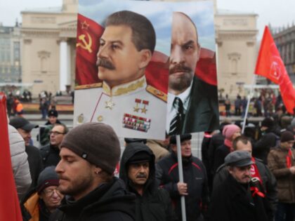 REVOLUTION SQUARE, MOSCOW, RUSSIA - 2017/11/07: The portrait of Vladimir Lenin and Joseph Stalin seen during the march. Thousands marched to Revolution Square in central Moscow to commemorate the 100th anniversary of the Russian Revolution. Many carried portraits of Lenin, Stalin, and flags with the emblem of the Soviet Union. …