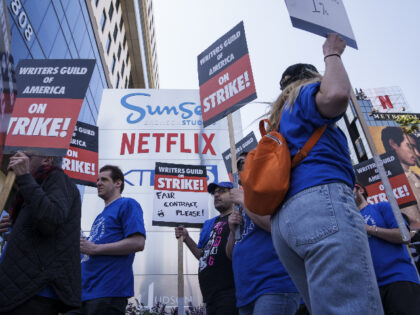 Writers Guild of America members and supporters on a picket line outside the Netflix Inc. offices in the Hollywood neighborhood of Los Angeles, California, US, on Tuesday, May 2, 2023. Writers for some of the most popular shows on television are walking off the job, striking for higher pay amid …