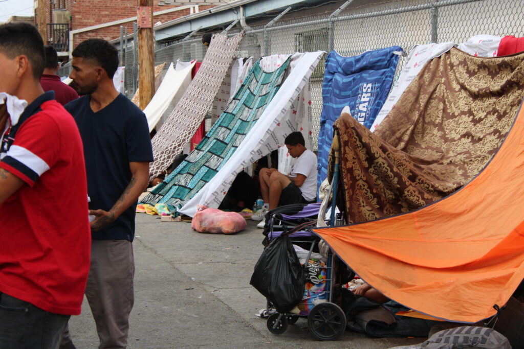 Migrants recently released by Biden administration camp our on the streets of El Paso. (Randy Clark/Breitbart Texas)