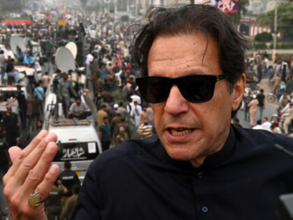 In this photograph taken on November 1, 2022, Pakistan's former prime minister Imran Khan speaks while taking part in an anti-government march in Gujranwala. - Khan was shot in the foot at a political rally on November 3, 2022 but he is in a stable condition, an aide said. (Photo …