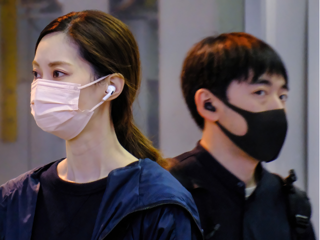 TOKYO, JAPAN - 2023/04/15: People wear face masks as a preventive measure against the nove