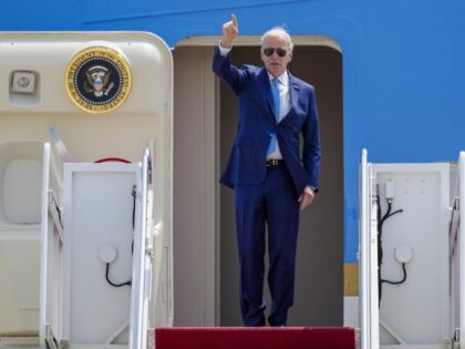 President Joe Biden gestures as he boards Air Force One at Andrews Air Force Base, Md., Wednesday, May 17, 2023, as he heads to Hiroshima, Japan to attend the G-7. (Jess Rapfogel/AP)