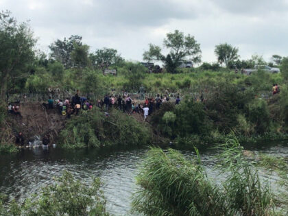 Texas military forces turn back migrants attempting to cross from Matamoros to Brownsville. (Breitbart Texas/ Cartel Chronicles)