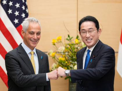 Rahm Emanuel (L), Ambassador-Designate of the United States, fist-bumps Japan's Prime Minister Fumio Kishida at the start of their meeting at the Prime Minister's official residence in Tokyo on February 4, 2022.