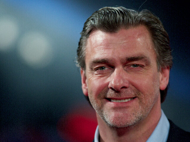 British film and television actor Ray Stevenson poses for pictures on the red carpet as he
