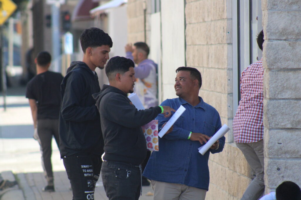 Groups of mostly Venezuelan migrants loiter in downtown Brownsville, Texas, after being released by Border Patrol agents. (Randy Clark/Breitbart Texas)