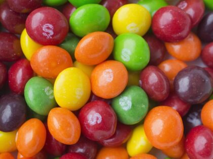 This June 1, 2016, file photo shows Skittles in New York. Skittles has temporarily ditched its rainbow theme in favor of an all-white look in the United Kingdom and Germany in order to celebrate LGBT pride. (Mark Lennihan, File/AP)