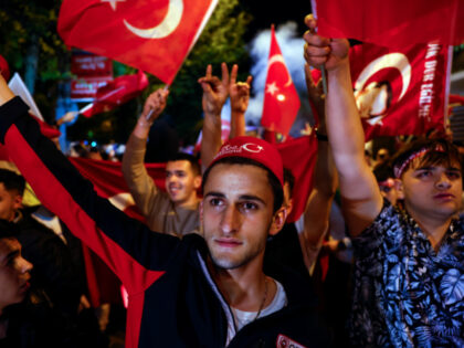 Supporters of Turkish President Recep Tayyip Erdogan celebrate at the AK Party headquarters on May 14, 2023 in Istanbul, Turkey. President Recep Tayyip Erdogan faced his biggest electoral test as the country voted in the general election. Erdogan has been in power for more than two decades -- first as …