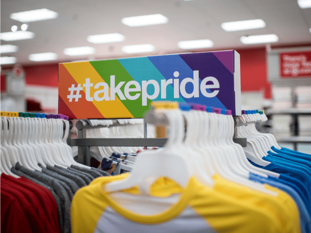 Signage for Target Corp.'s "#TakePride" initiative sits above products displayed for sale