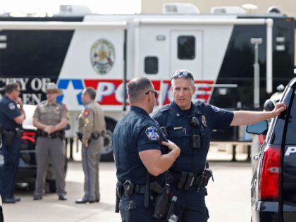 ALLEN, TEXAS - MAY 7: Law enforcement works the scene on the day after a shooting at Allen Premium Outlets on May 7, 2023 in Allen, Texas. According to reports, a shooter opened fire at the outlet mall, killing eight people. The shooter, who has not been identified, was then …